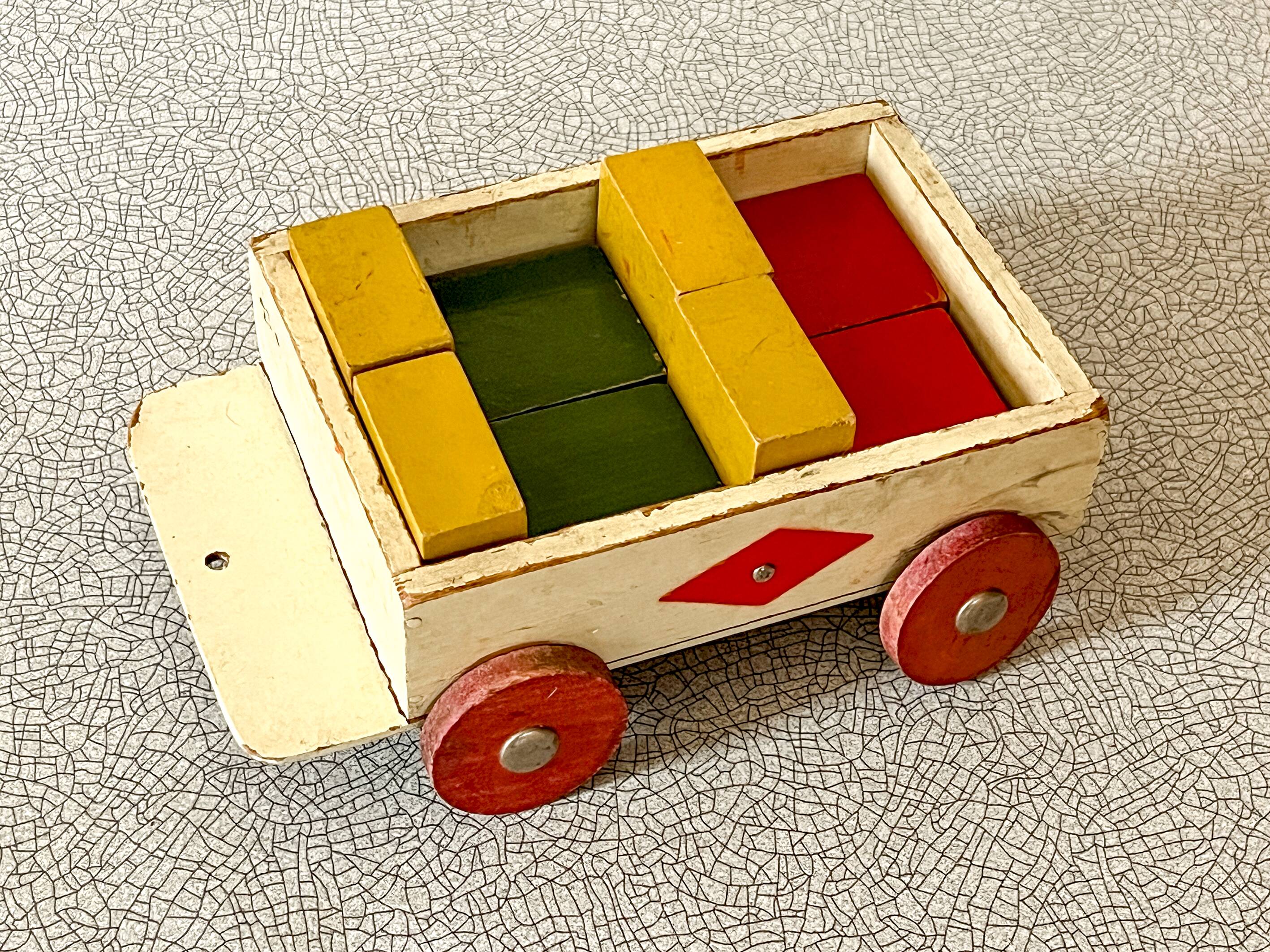 Wooden pull-along toy with coloured blocks, vintage toy.