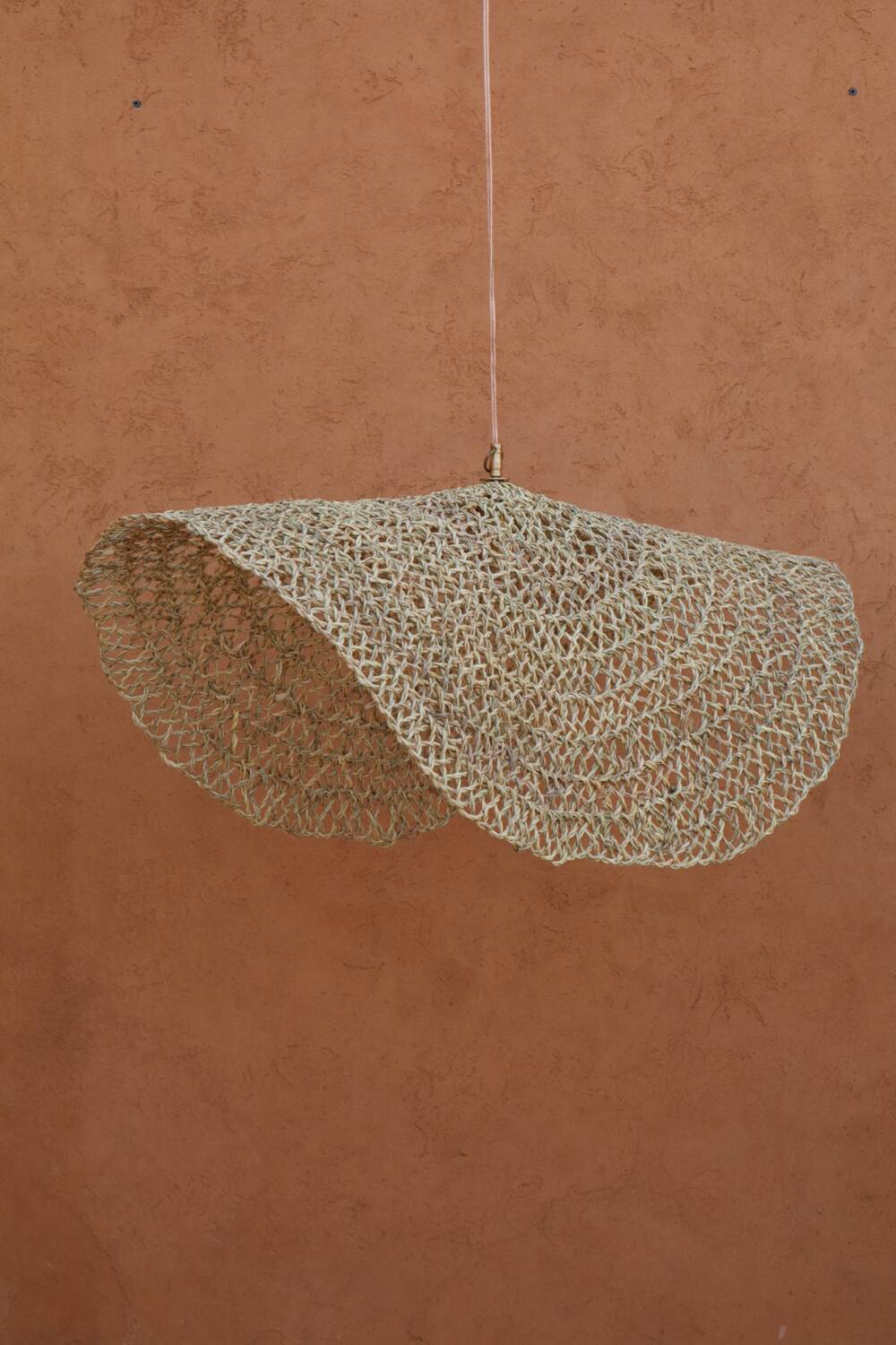 Handmade wicker hanging basket with brass finish