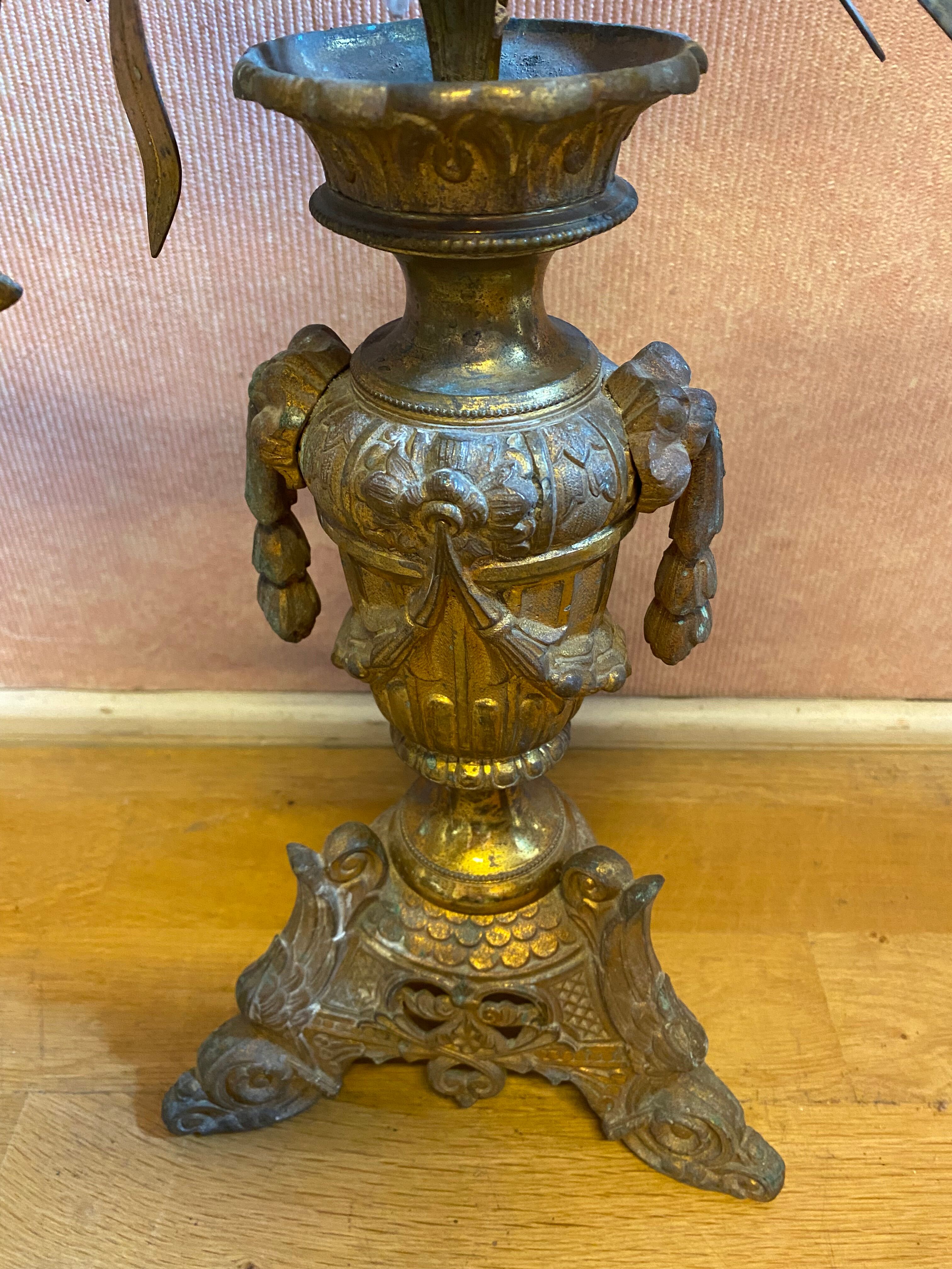Pair of gilded bronze church candelabras.