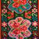 Colorful kilim on black background with floral design