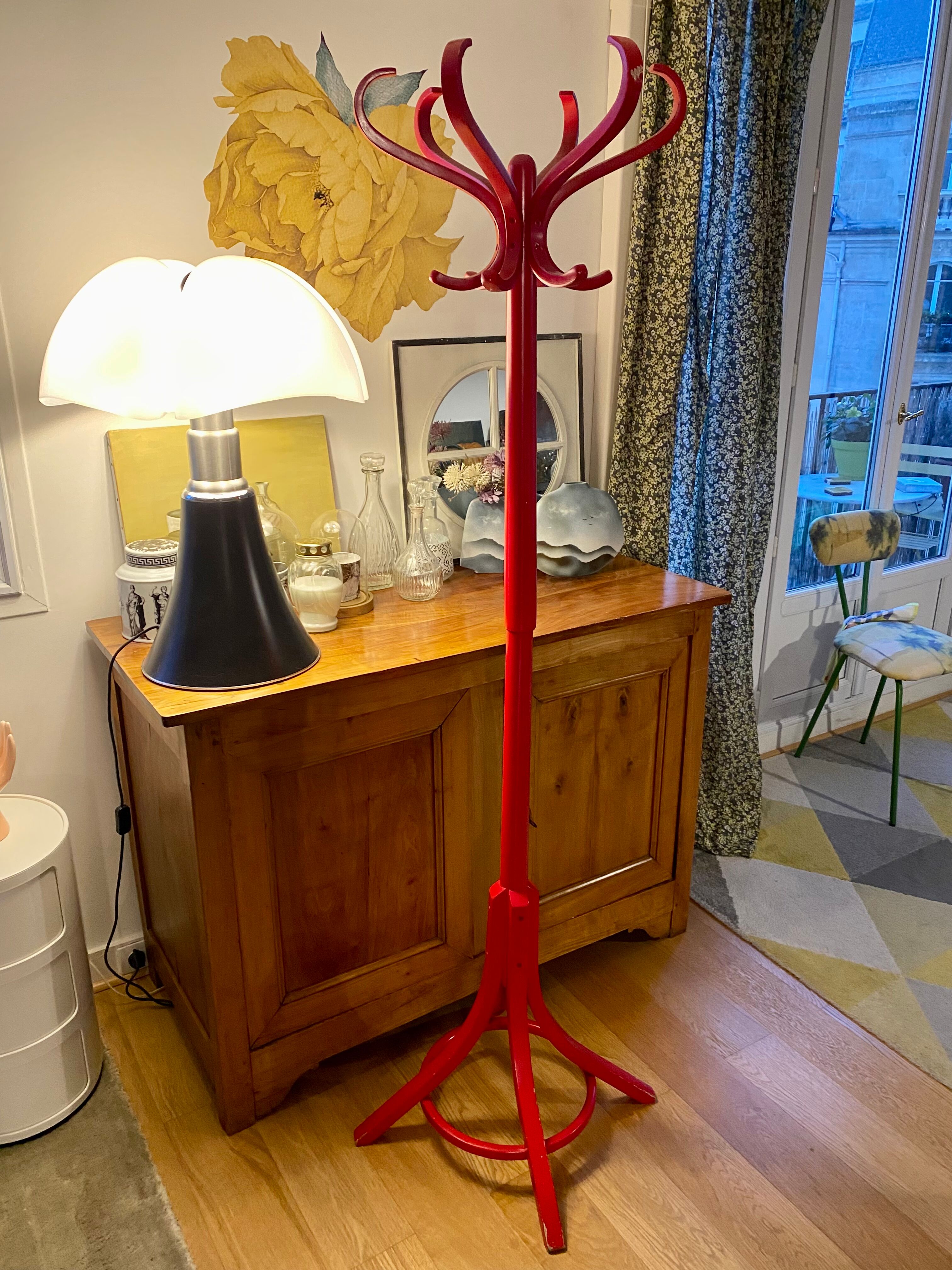 Red Baumann parrot coat rack