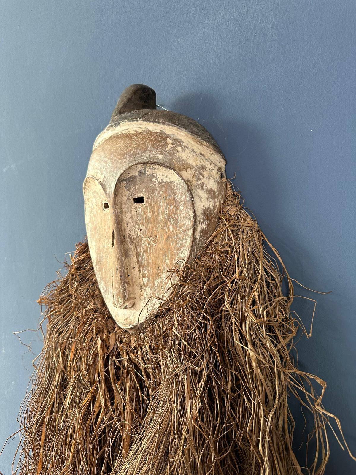 Long face tribal mask with narrow eye-holes