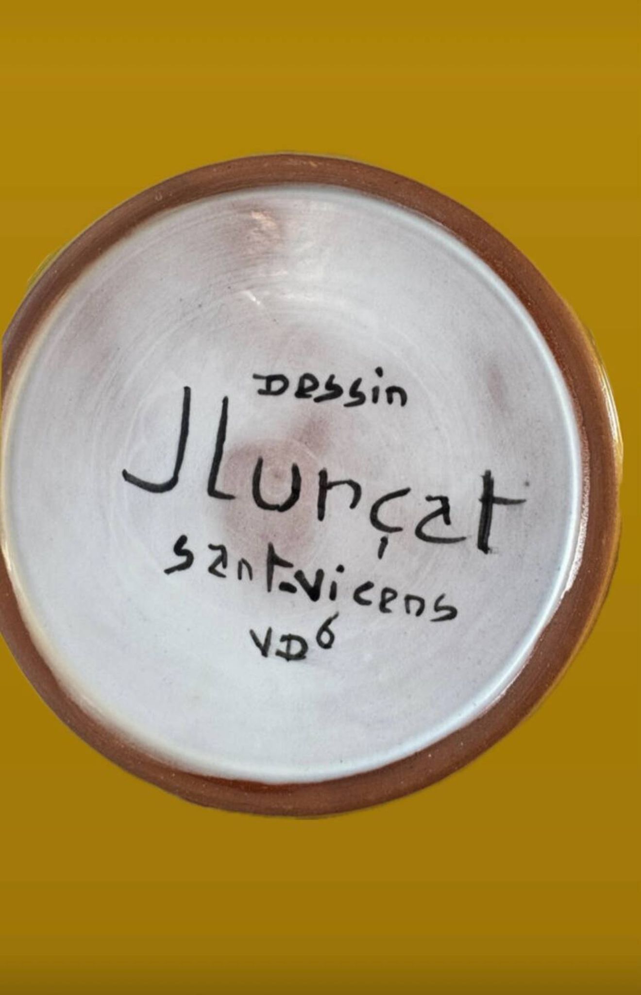 Terracotta plate, Jean Lurçat decorated with a rooster and foliage.