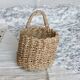 Small vintage woven fiber wall basket with handle