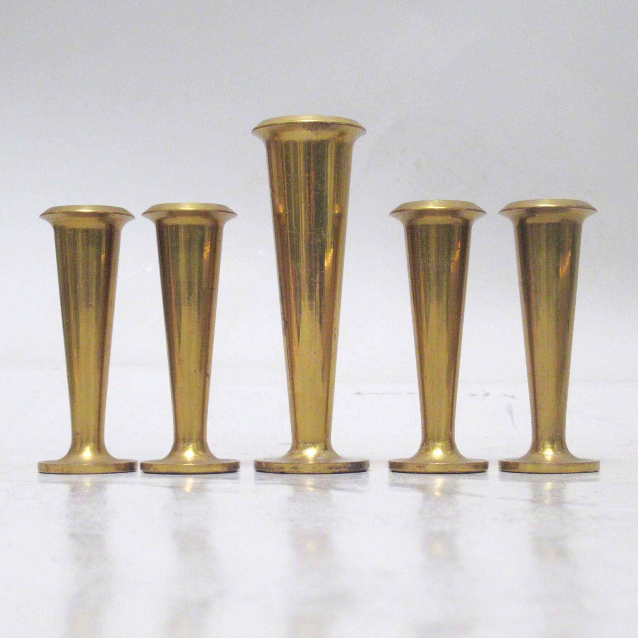 Five scandinavian brass candle holders 60s