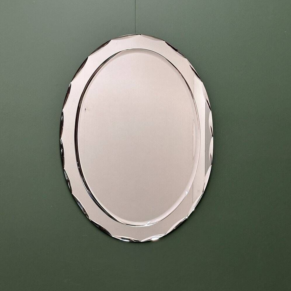 1970s Italian oval mirror by Crystal Arte with faceted glass frame