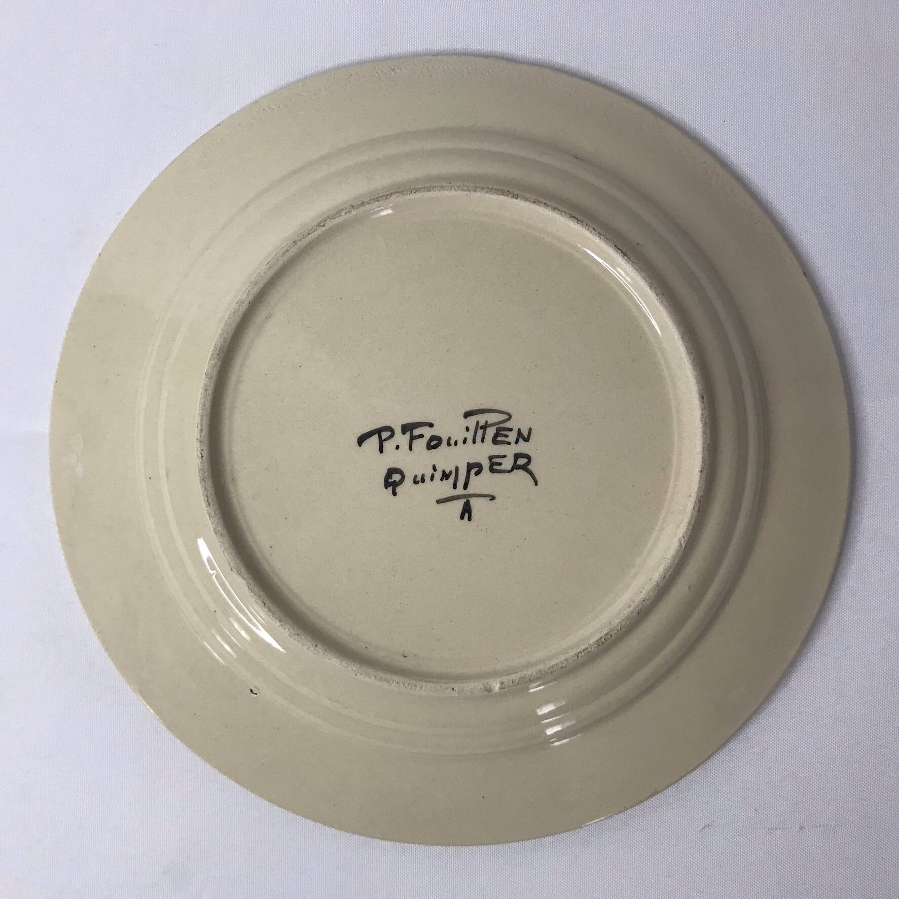 Quimper, polychrome earthenware plate signed Paul Fouillen, early 20th century