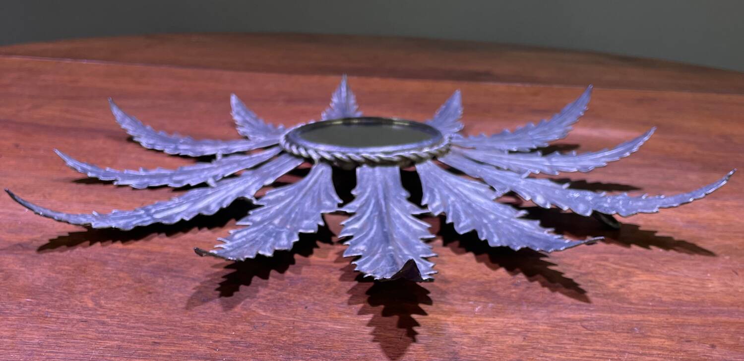 Metal mirror with foliage decoration