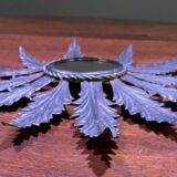 Metal mirror with foliage decoration