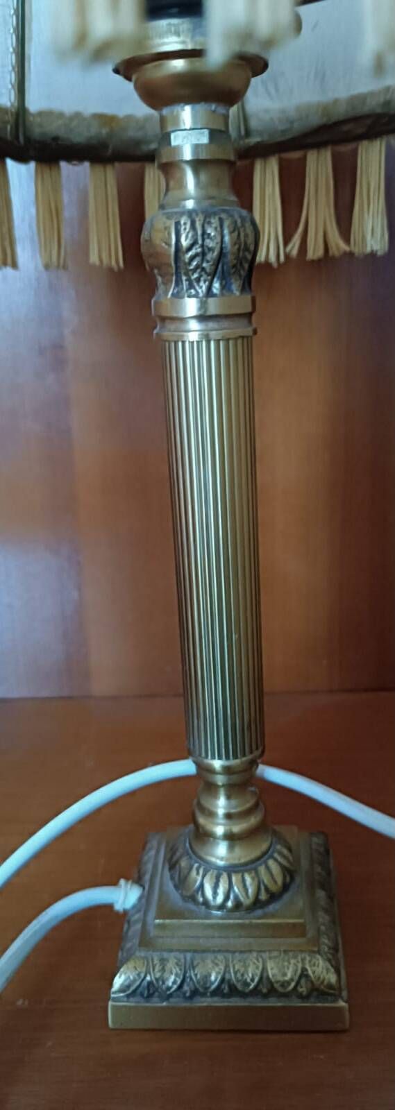 Brass bedside lamp with natural bladder shade.