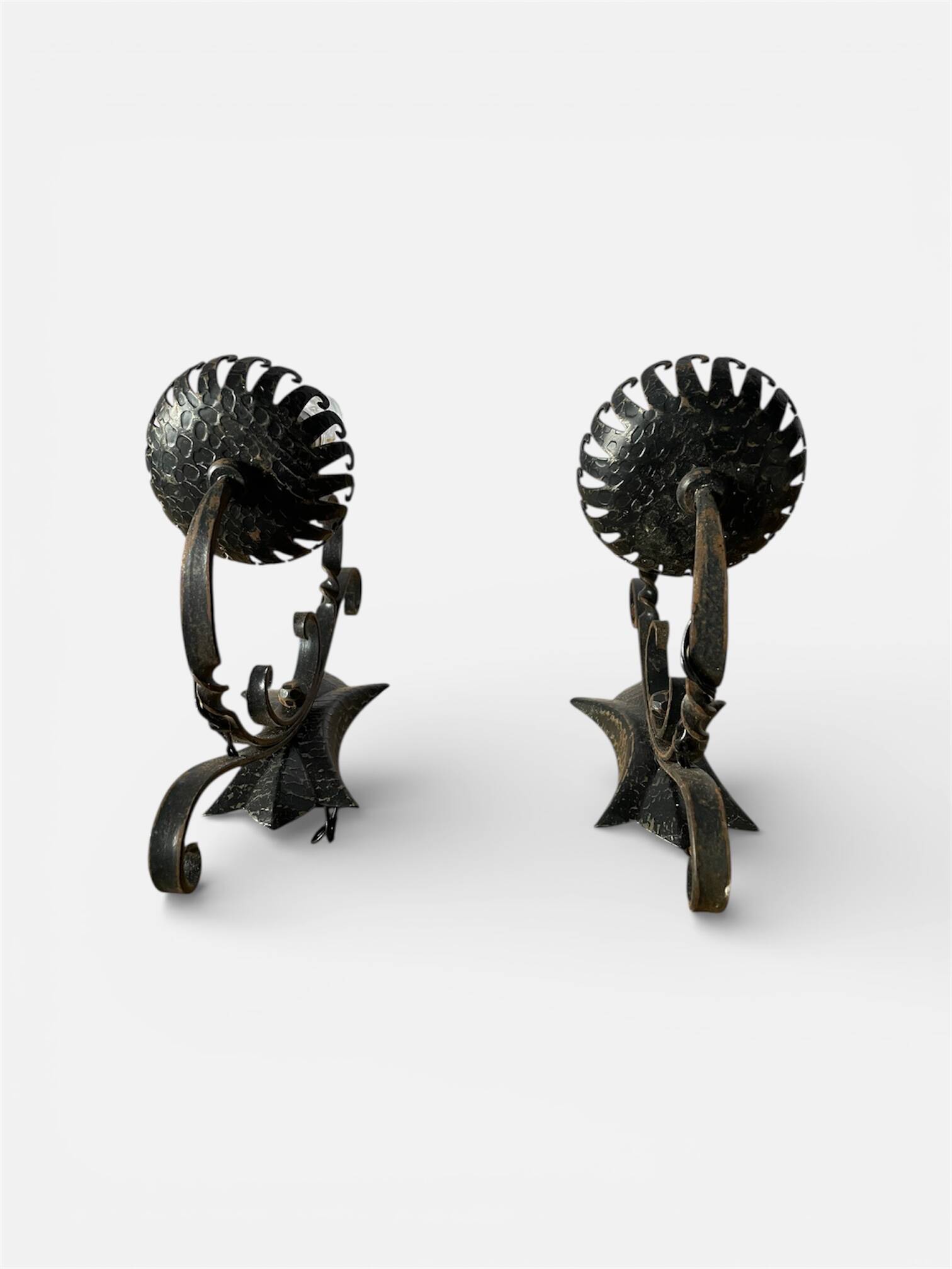 Vintage wrought iron wall lights in rustic gothic style.