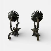 Vintage wrought iron wall lights in rustic gothic style.