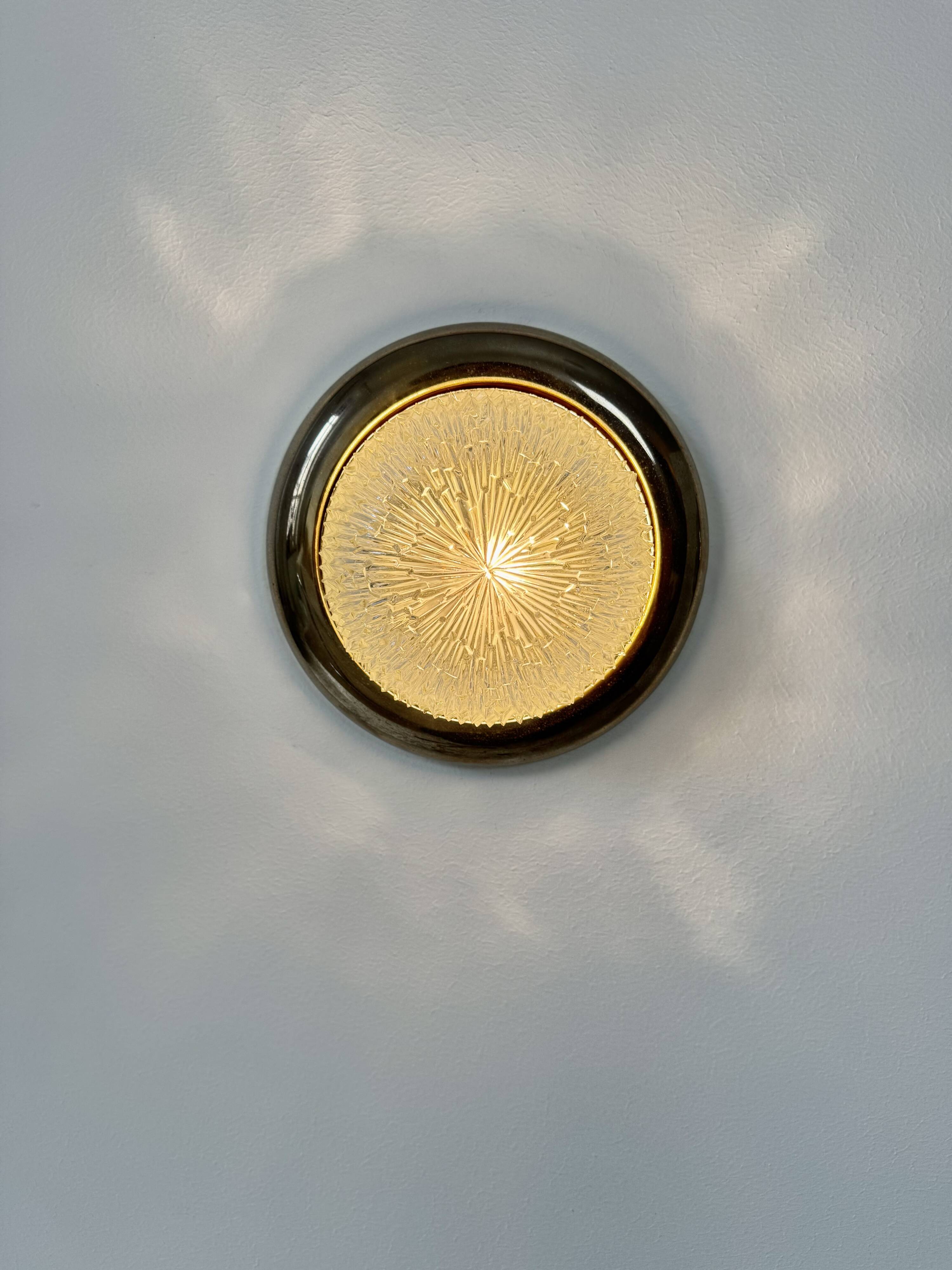 Pair of vintage wall lights, brass and pressed moulded glass, France, 1960.