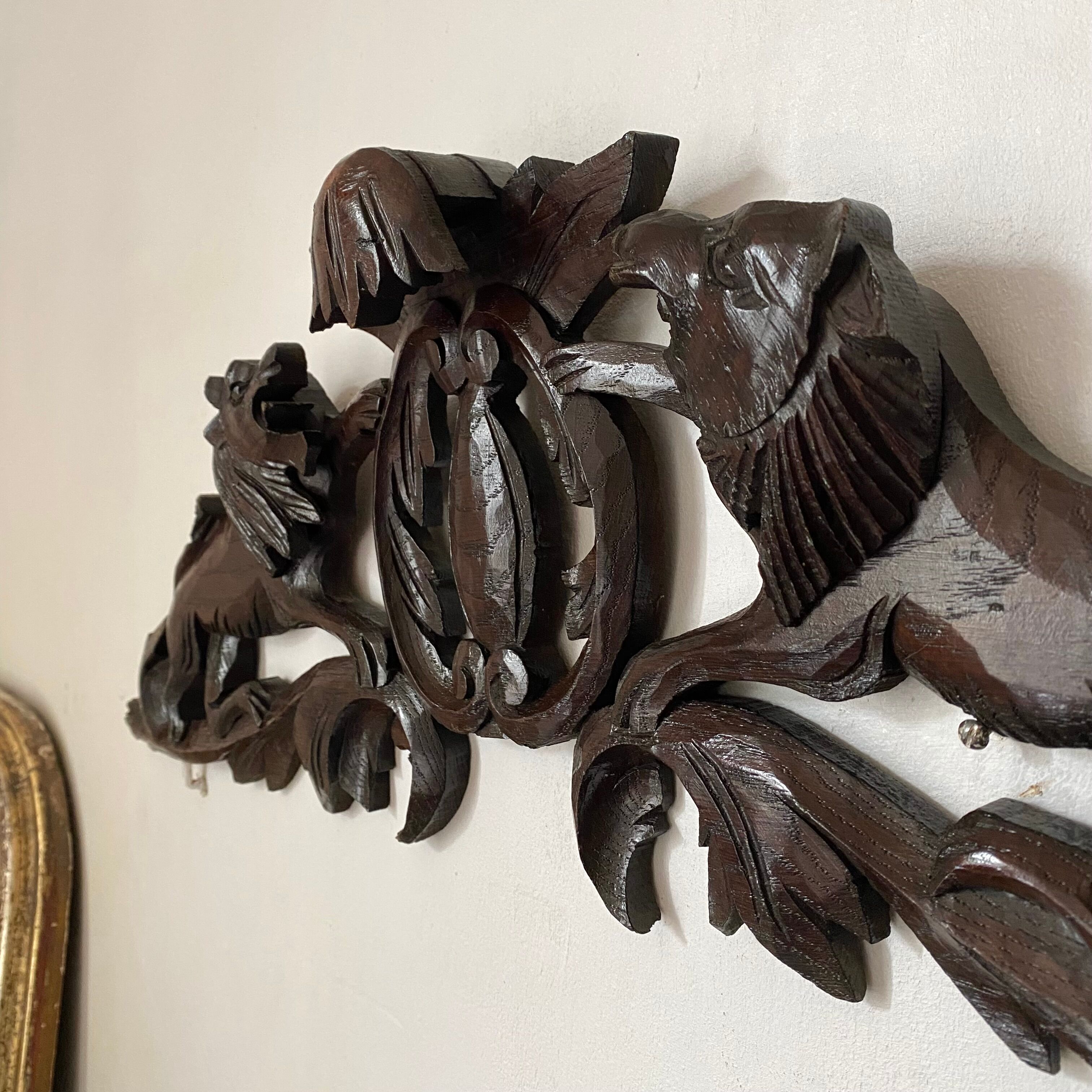 Antique carved wooden pediment with lions and medallion