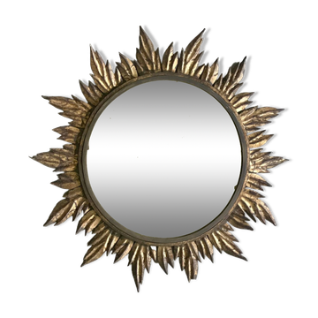 Miroir soleil à décor de feuilles dorées, vers 1950.