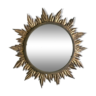 Sun mirror decorated with golden leaves, circa 1950.