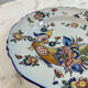 Flat plate in earthenware with polychrome decoration in Rouen style