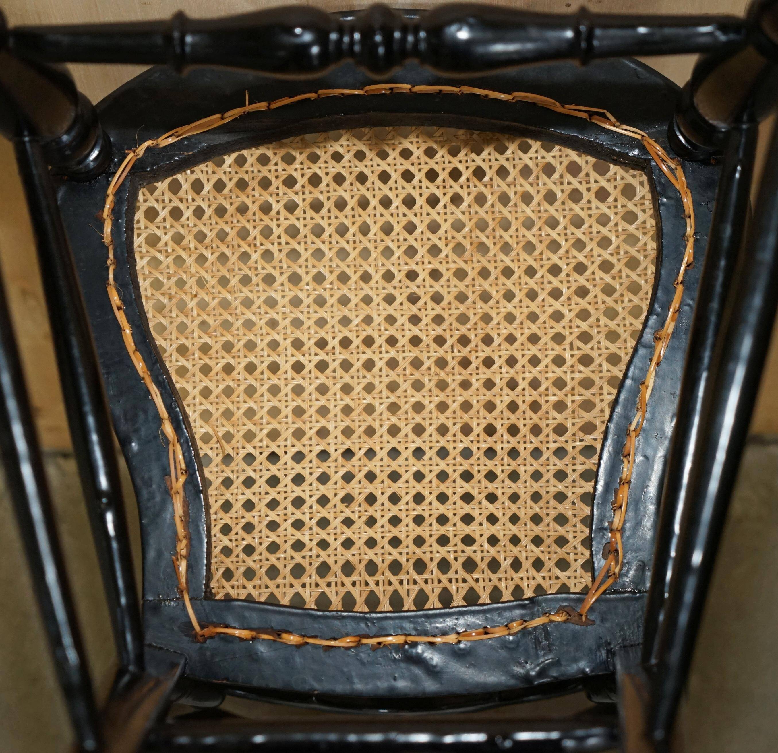 Four antique Regency bergère chairs with mother-of-pearl inlay.