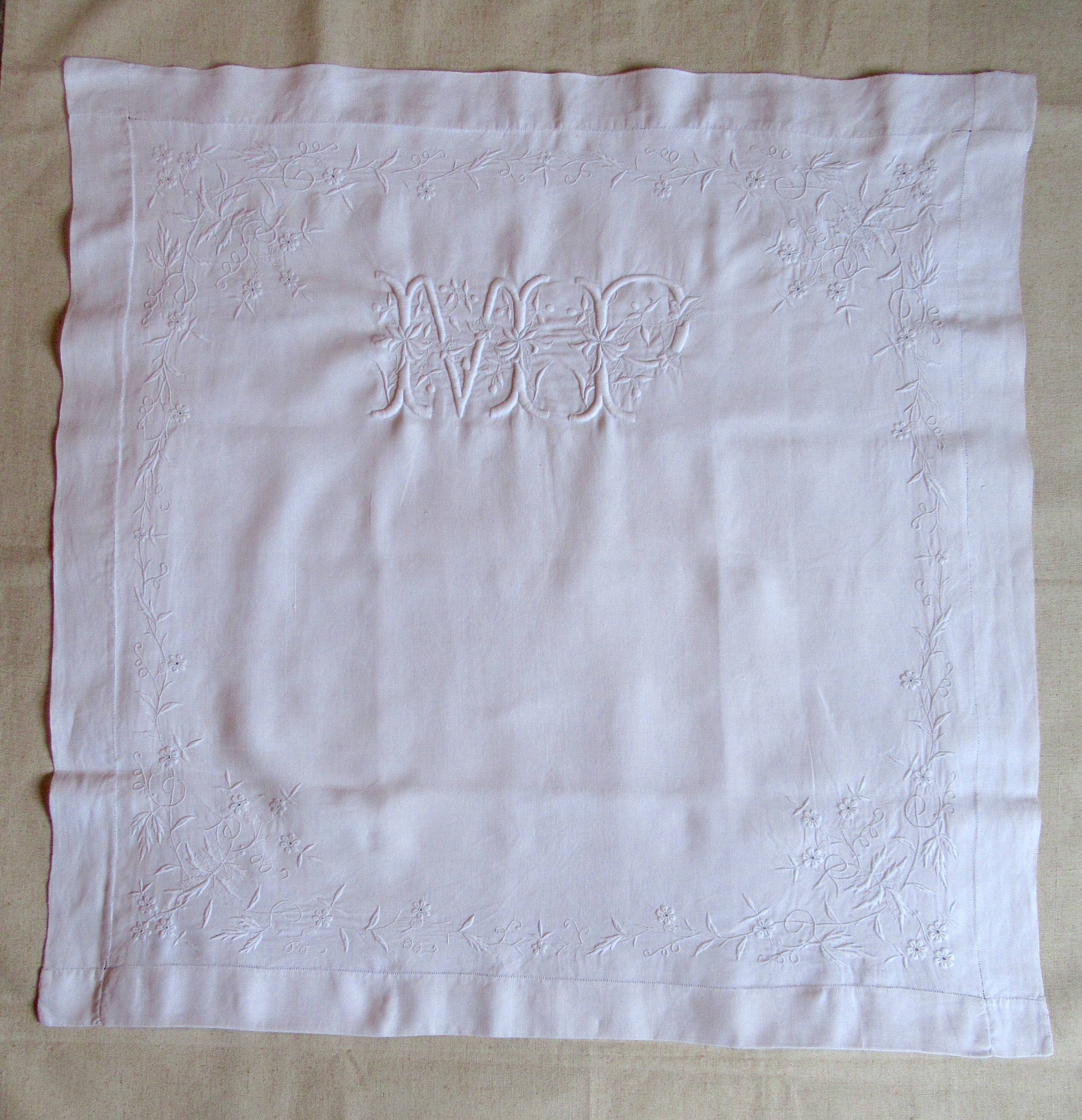 old pillowcase embroidered with fine flowers, marked MP, 19th