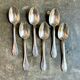 6 small silver metal spoons