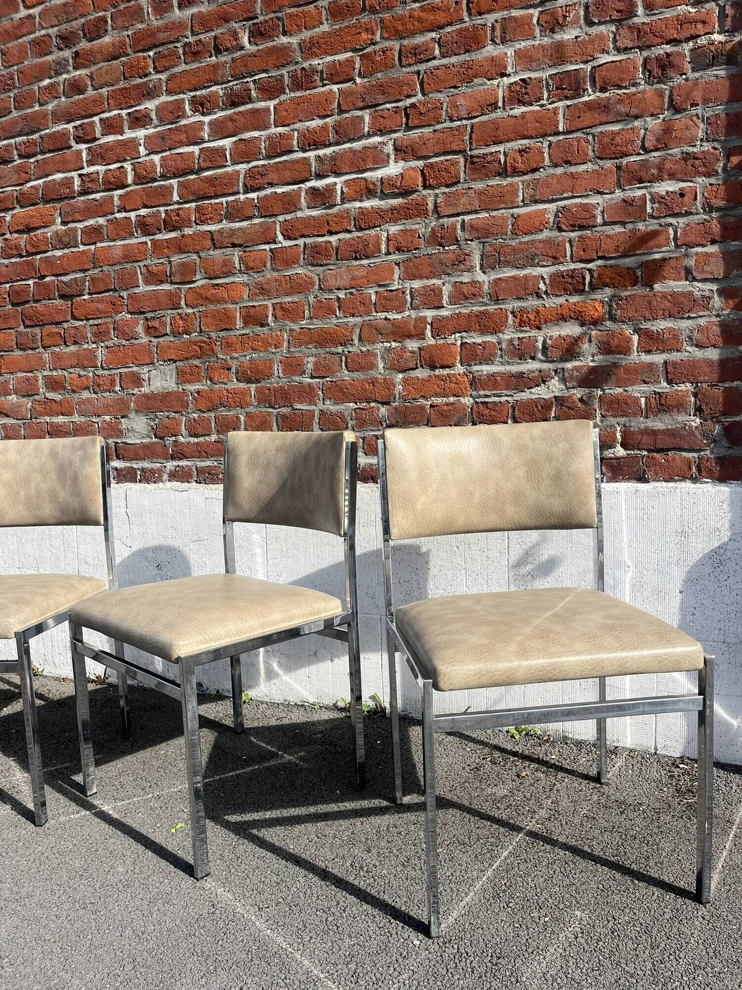 Set of 4 vintage chairs in chrome and faux leather.