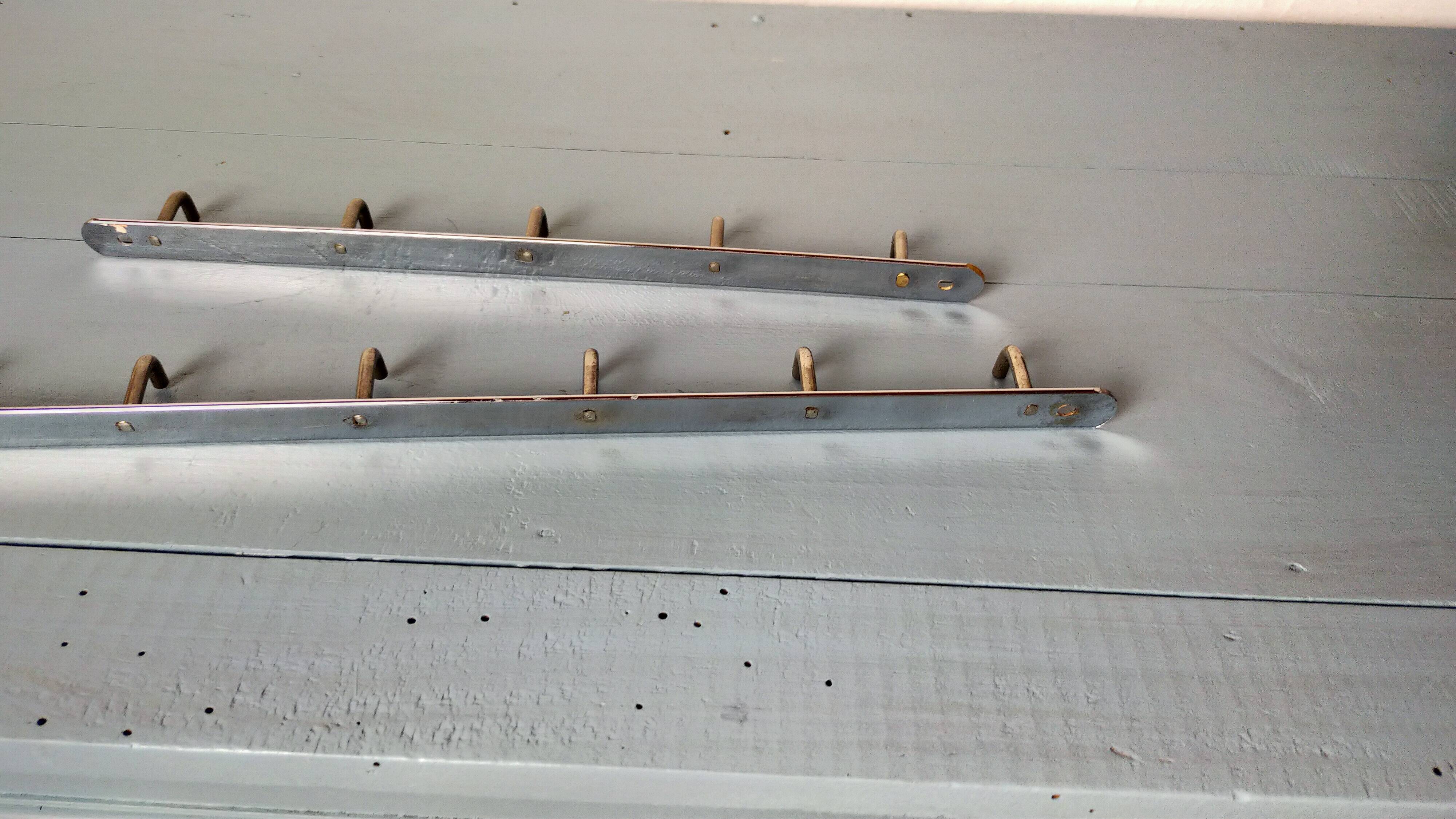 Two chrome tea towel hooks