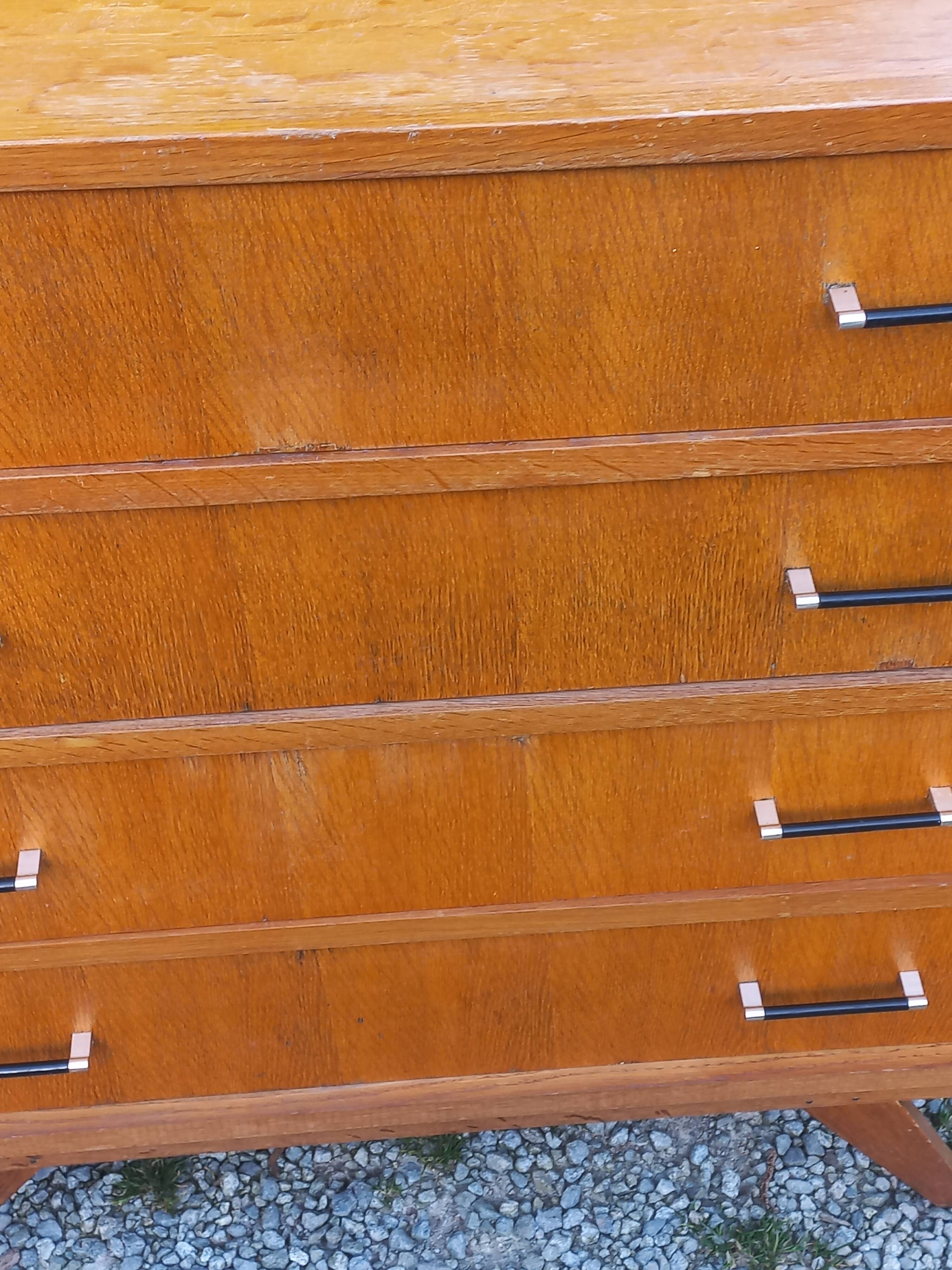 Vintage oak commode with tapered legs and wings from the 1950s.