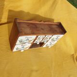 Vintage wooden spice rack with ceramic drawers