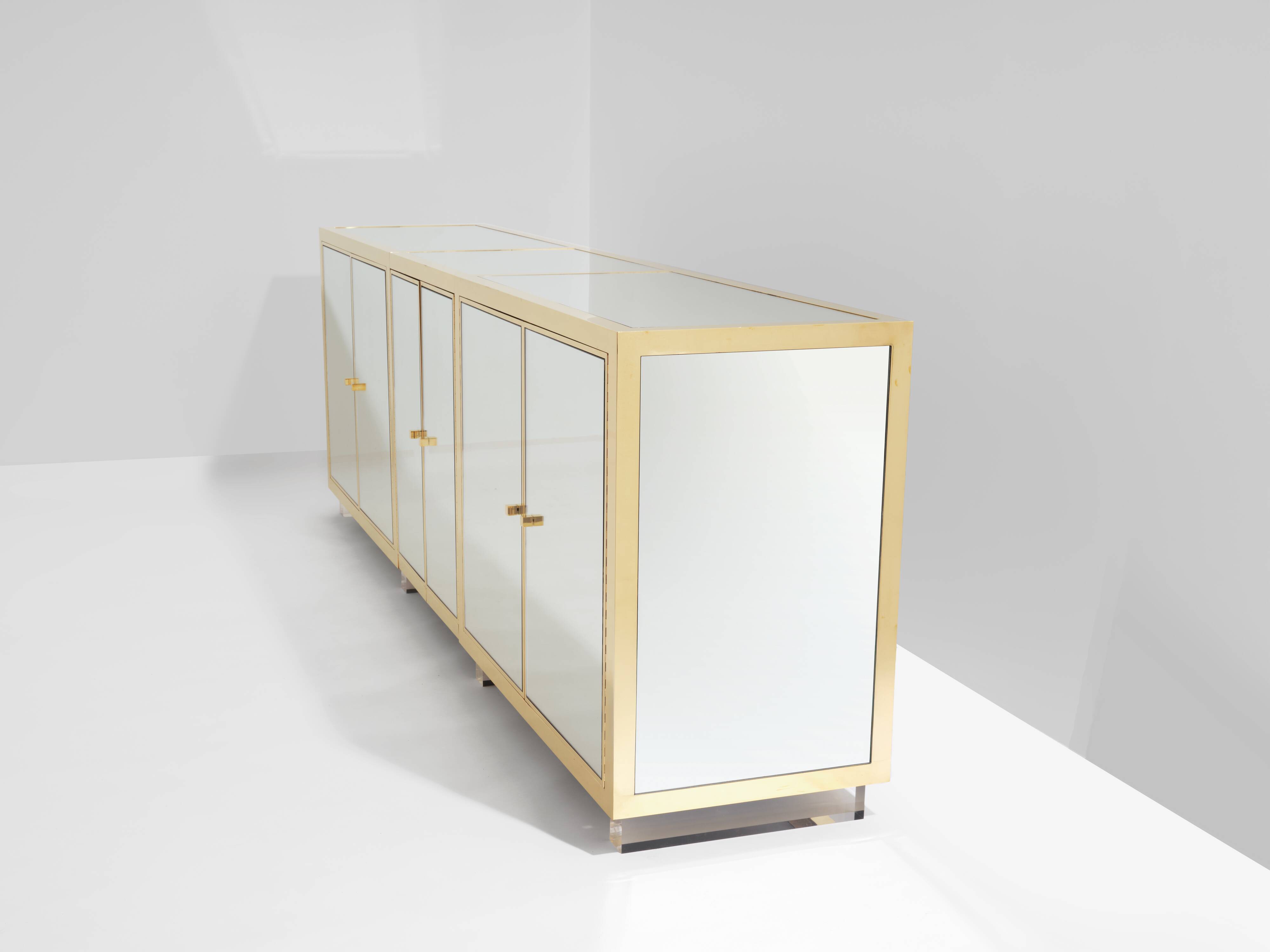 Brass sideboard with mirror and plexiglass legs by Michel Pigneres, 1970