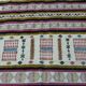 Handmade Berber kilim rug with multicoloured tribal motifs.
