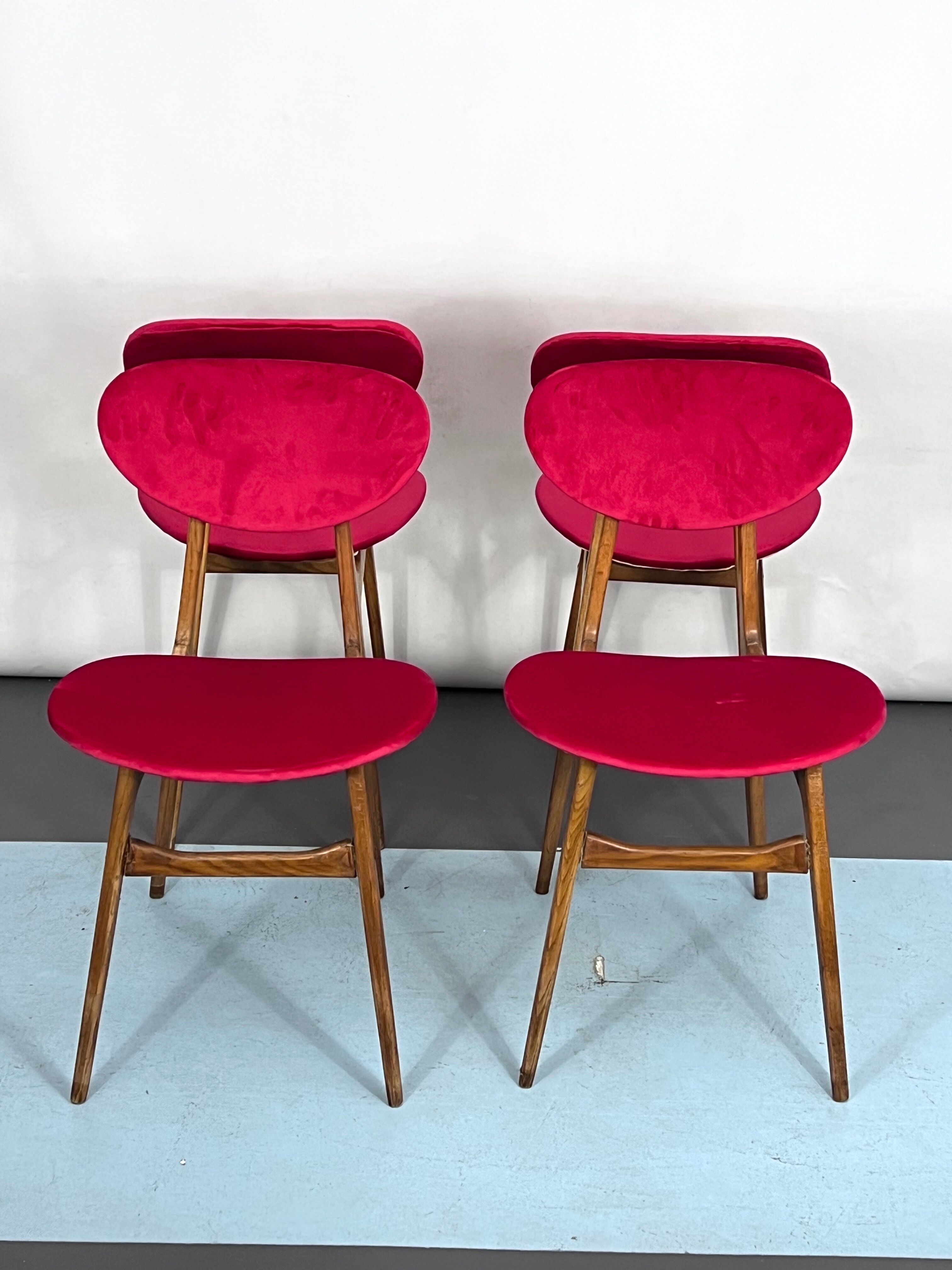 Set of four red velvet and wood dining chairs, Italy 1950