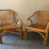 Duo of rattan armchairs with cushions