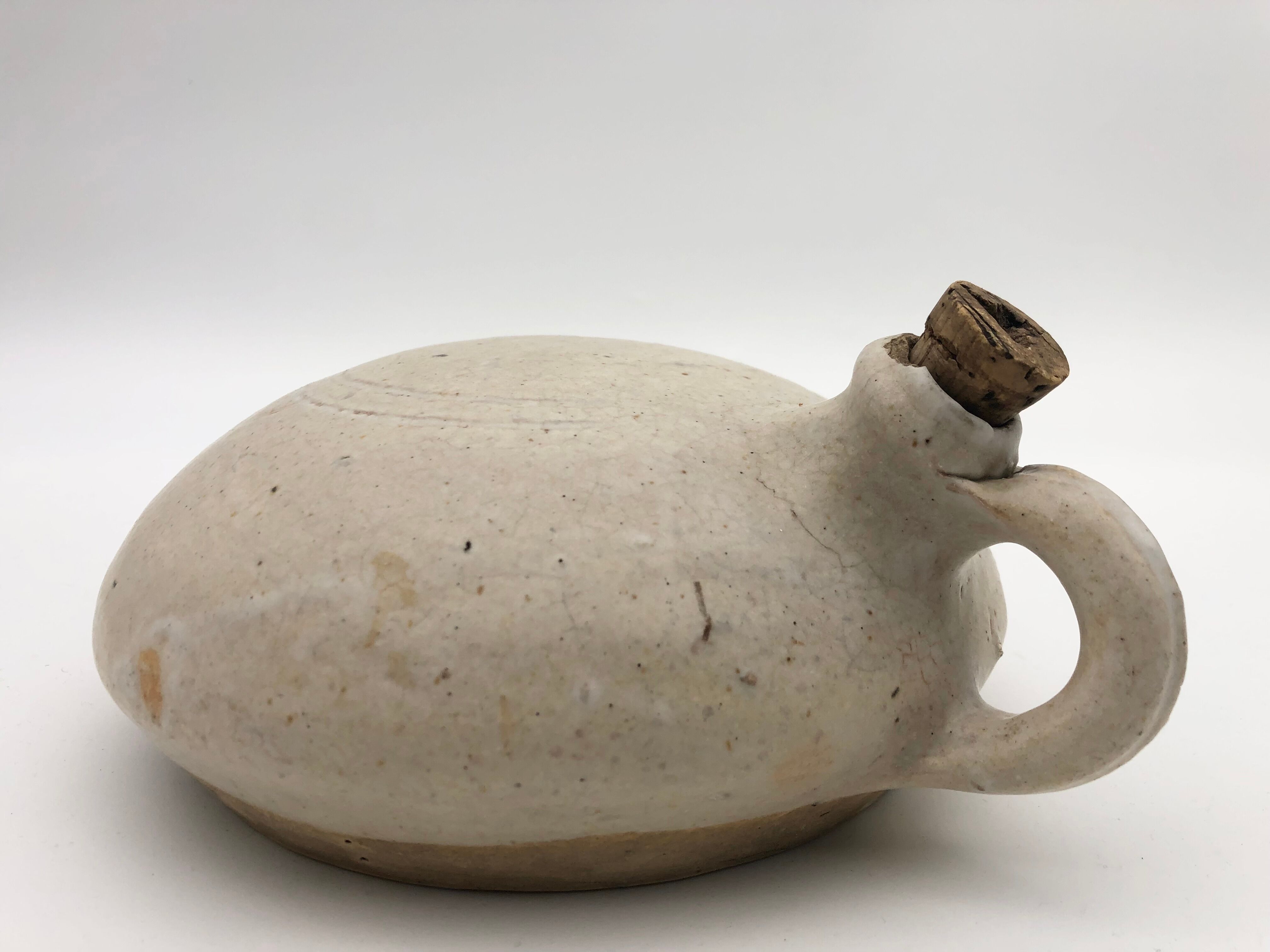 Old round sandstone hot water bottle