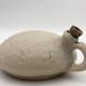 Old round sandstone hot water bottle