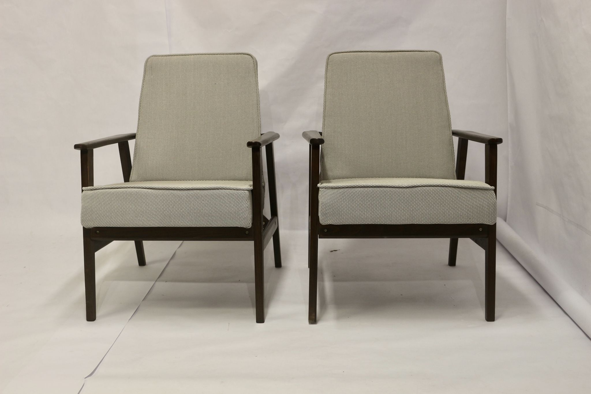 Pair of Henryk Lis armchairs 300-190s 1970s reupholstered gray textured fabric.