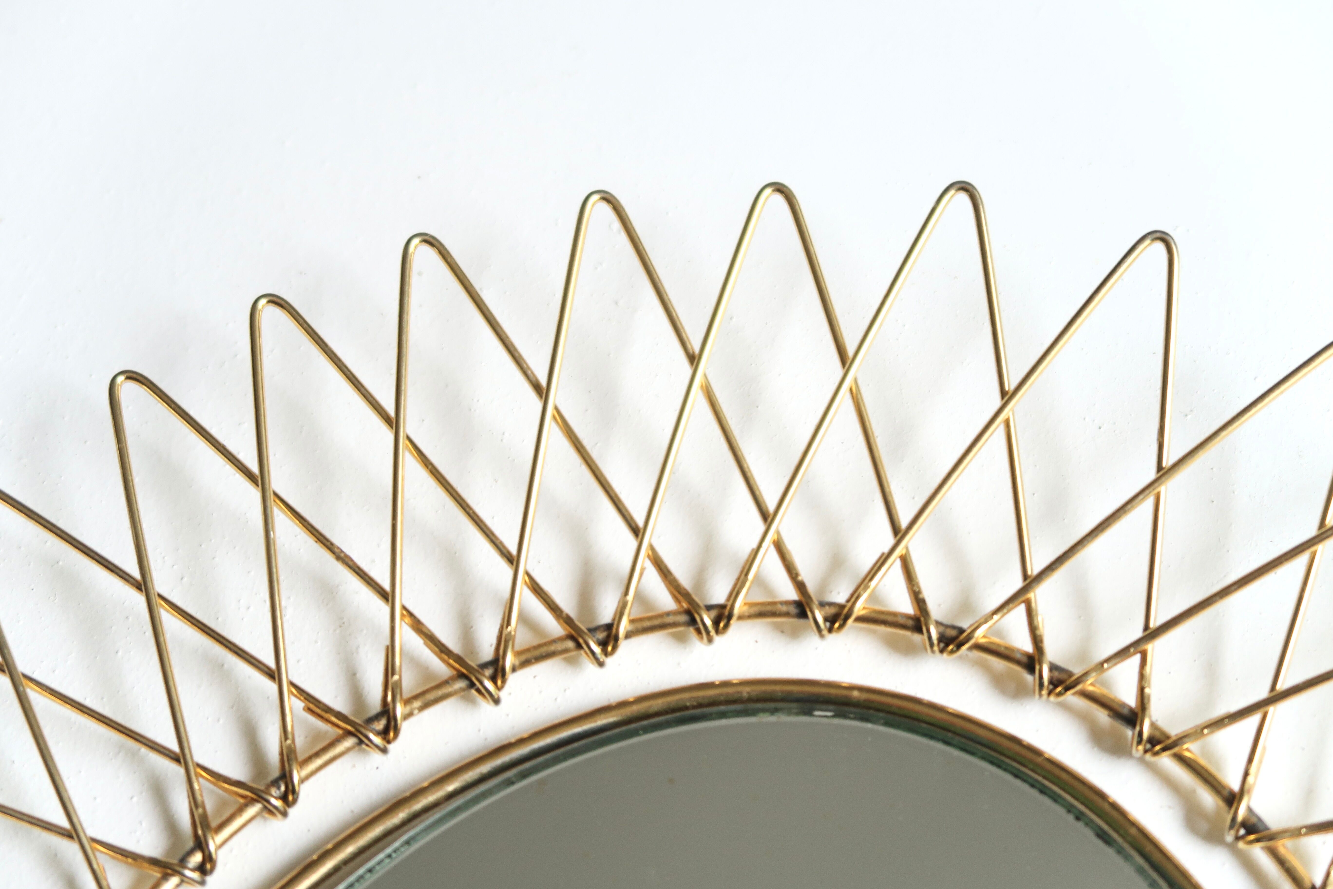 Oval golden sun mirror in metal, 1960s