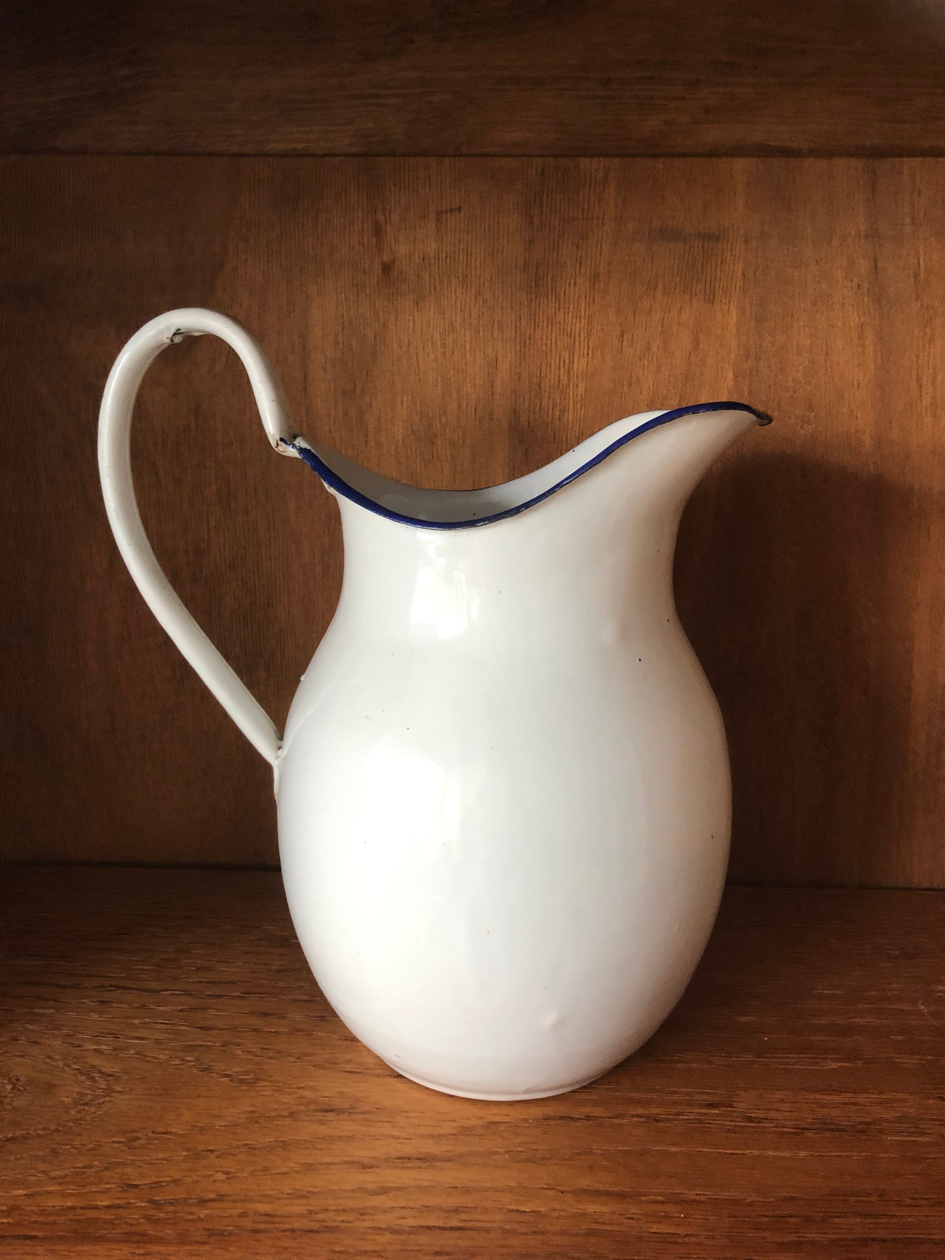 Enamelled plate pitcher