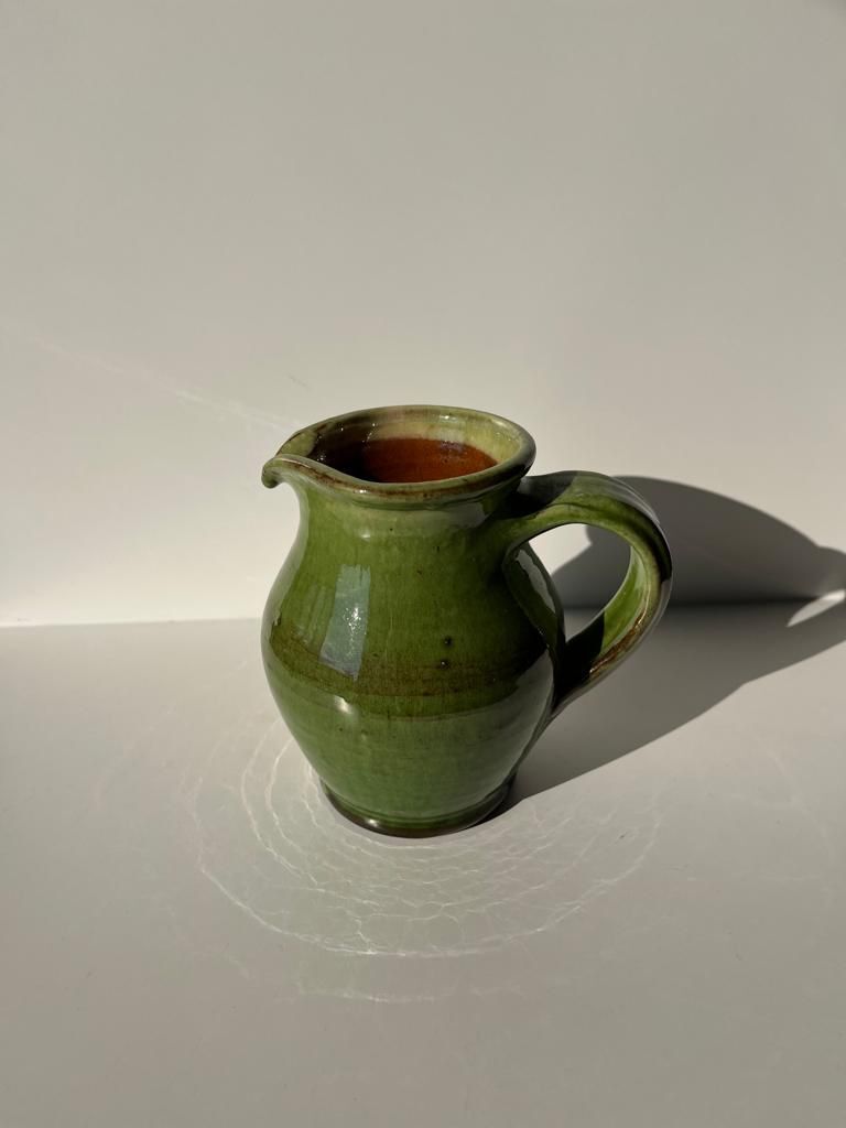 Green glazed ceramic pitcher