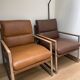 A pair genuine leather armchairs.