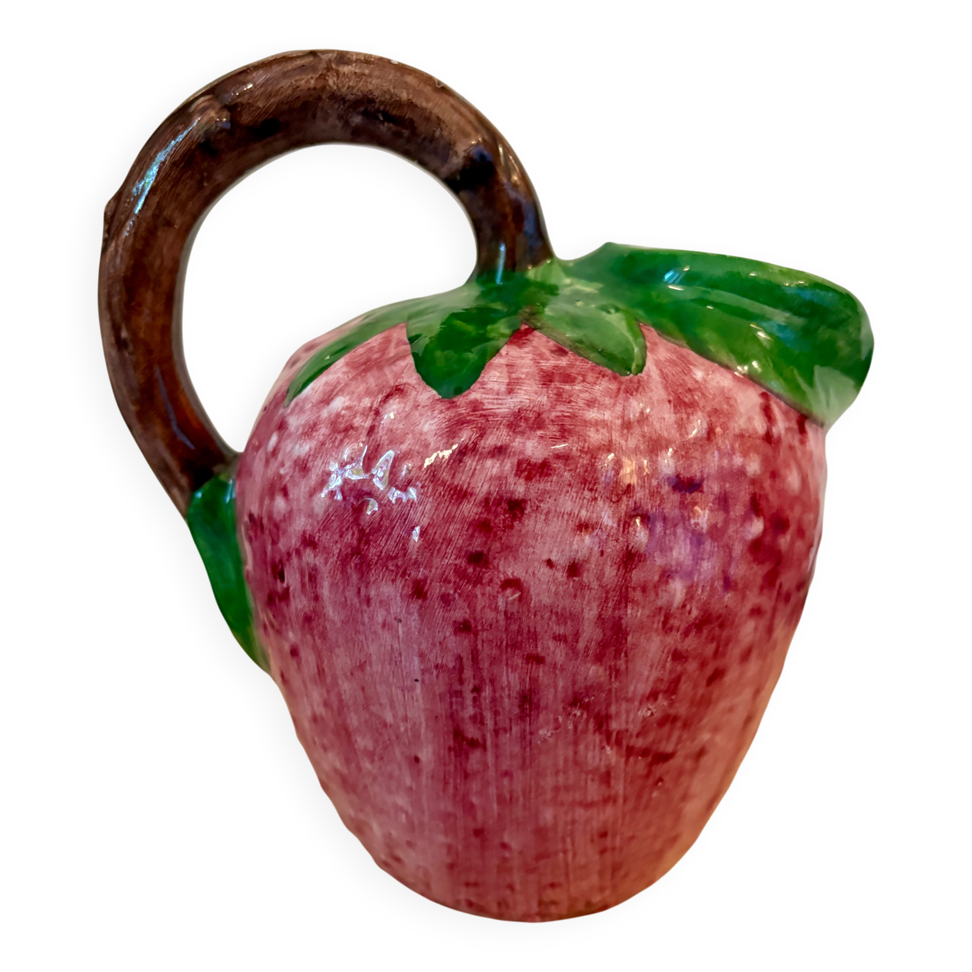 Ceramic jug in the shape of a strawberry.