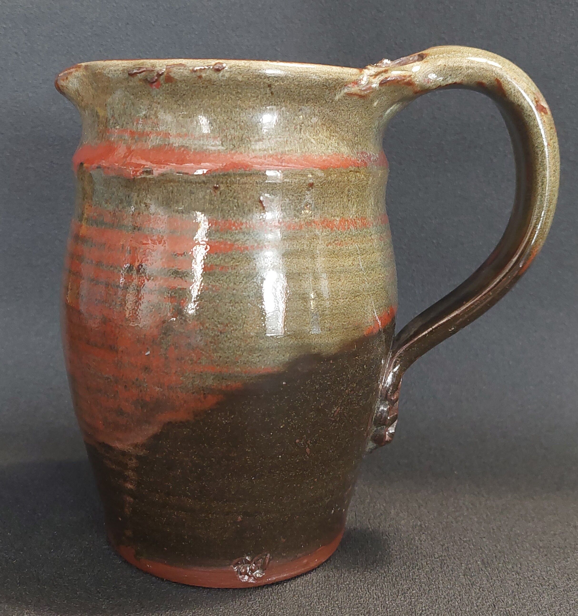 Ceramic pitcher from the 20th century with a signature to identify.