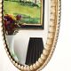 Large oval Florentine mirror in carved wood and gilded with gold leaf.
