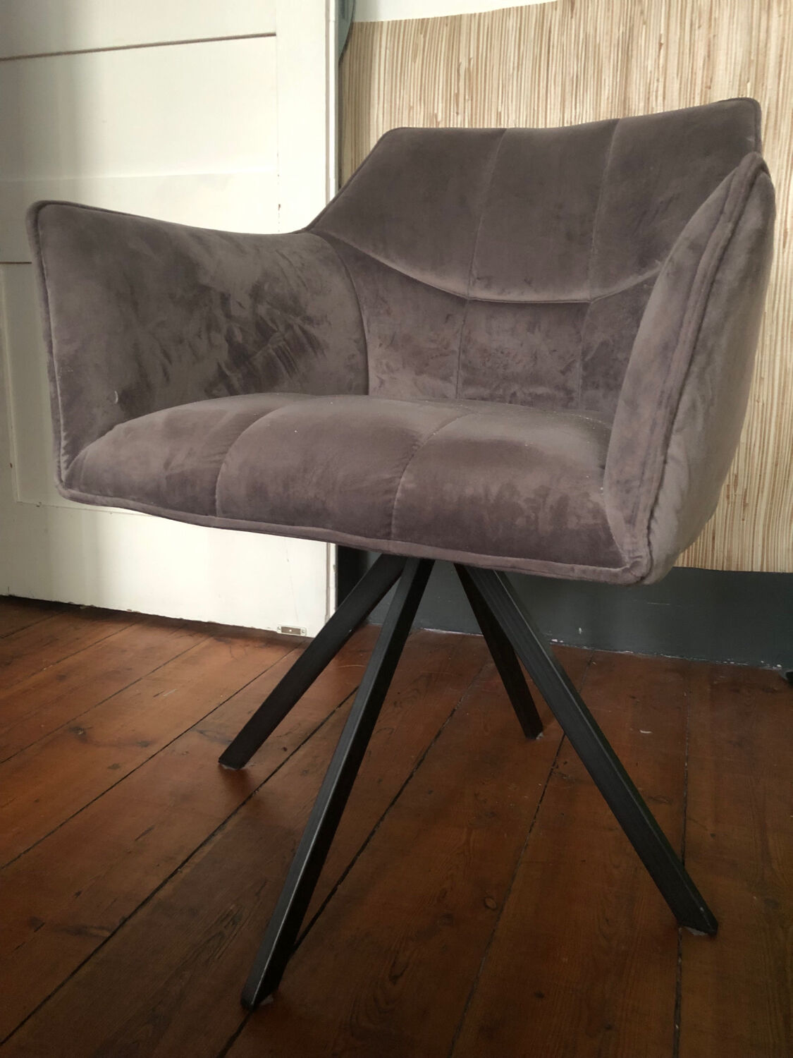 Grey fabric swivel chair in industrial style