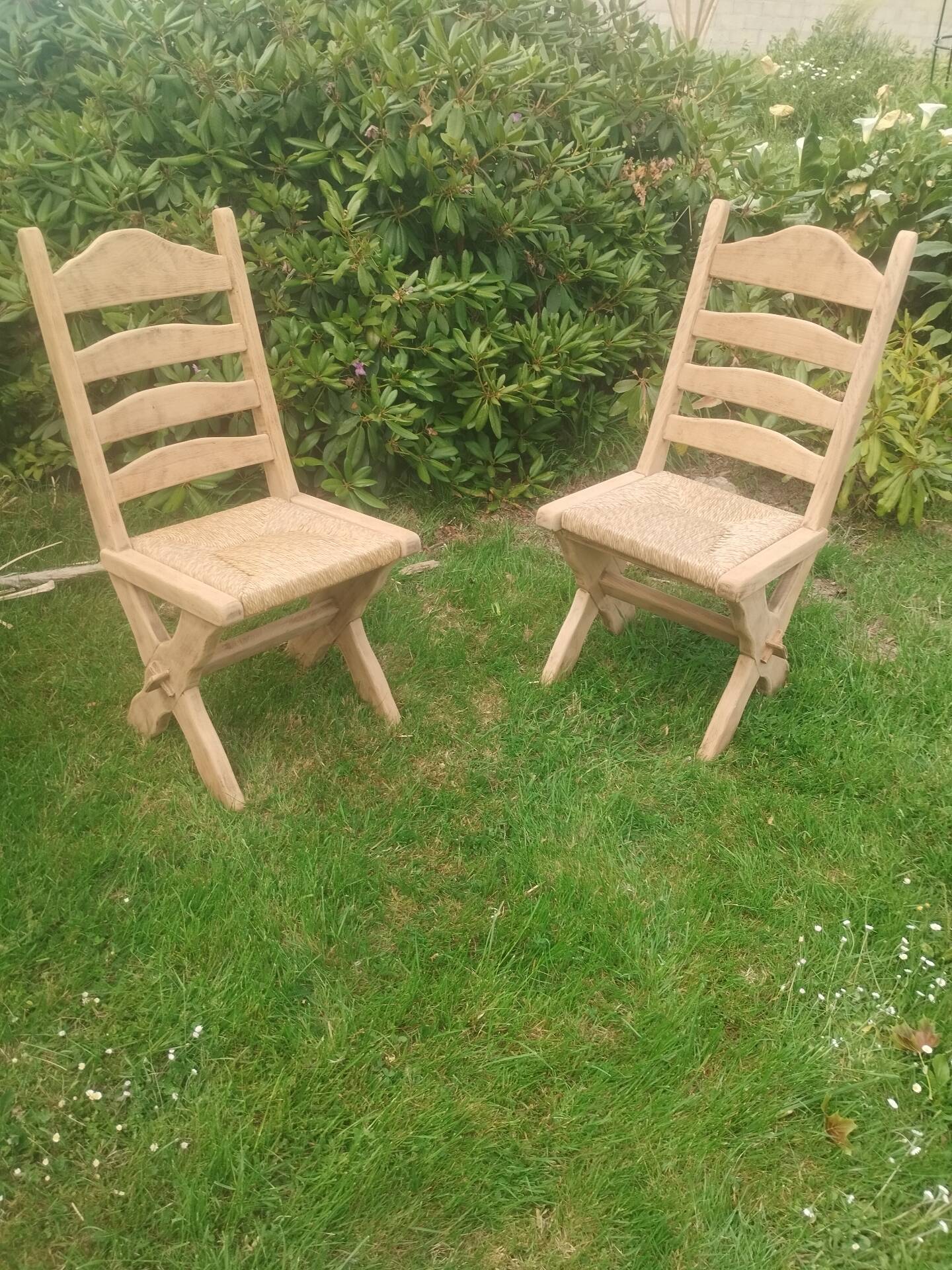 Pairs of vintage Scandinavian chairs with splayed legs.