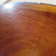 Tripod coffee table - solid okoumé wood - organic shape - brutalist style