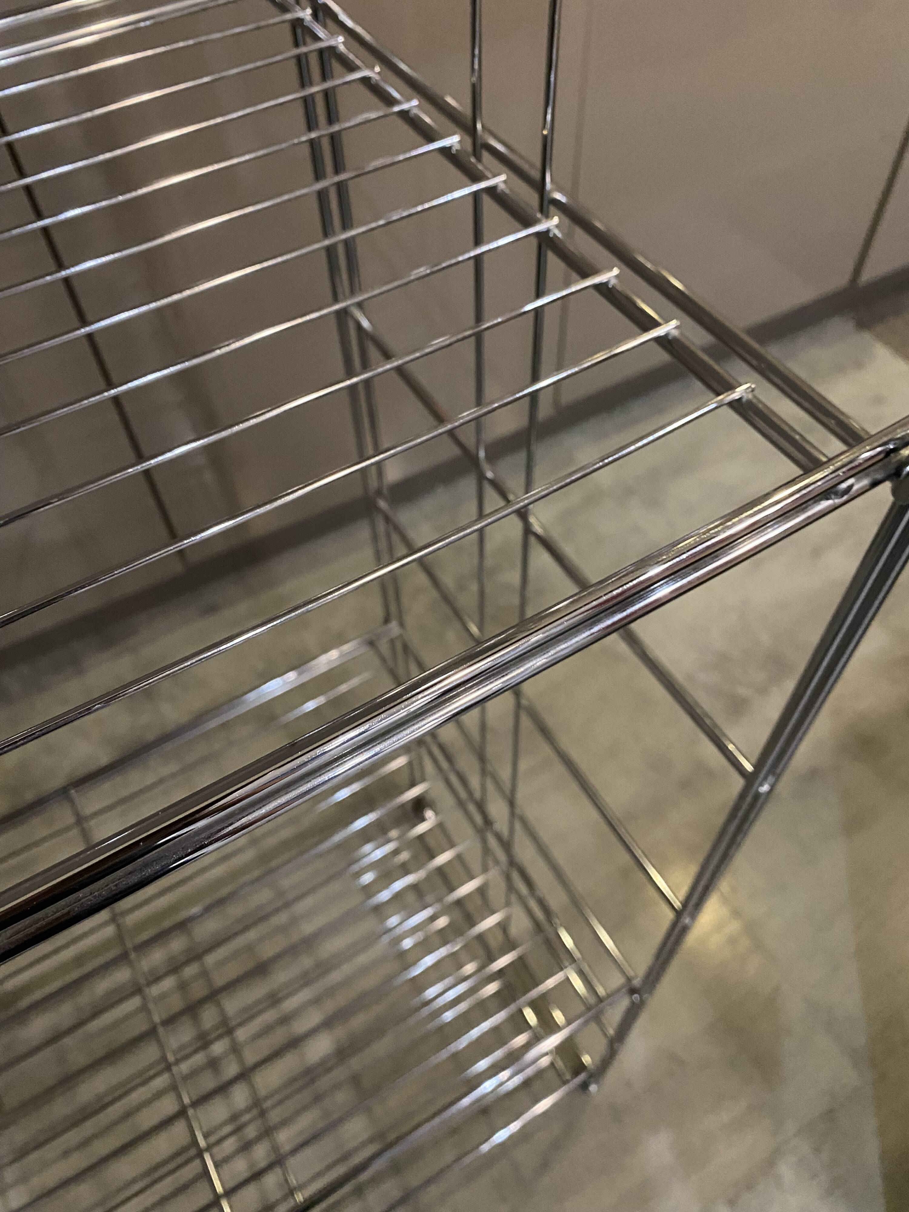 Modular wall bookshelf desk in vintage chrome.