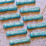 Antique Art Deco knife rest in turquoise earthenware