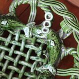 Antique woven basket in green glazed ceramic, fish decoration