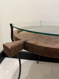 decorative wrought iron round table, glass and wood top.