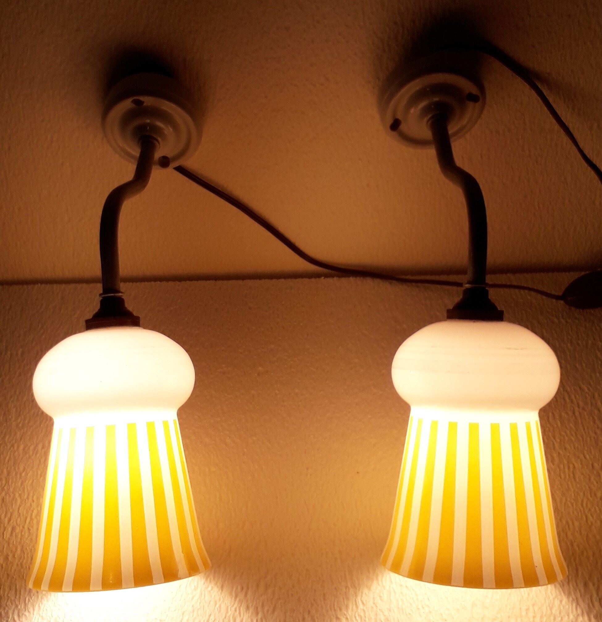 Duo of swan collar wall lamps